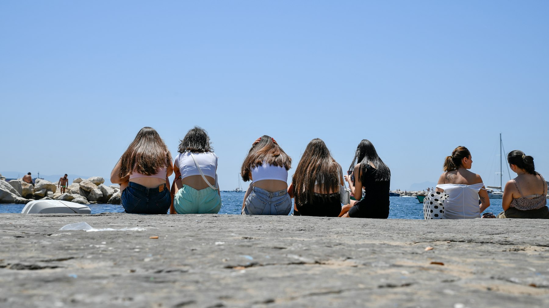 Friends together beside the coast