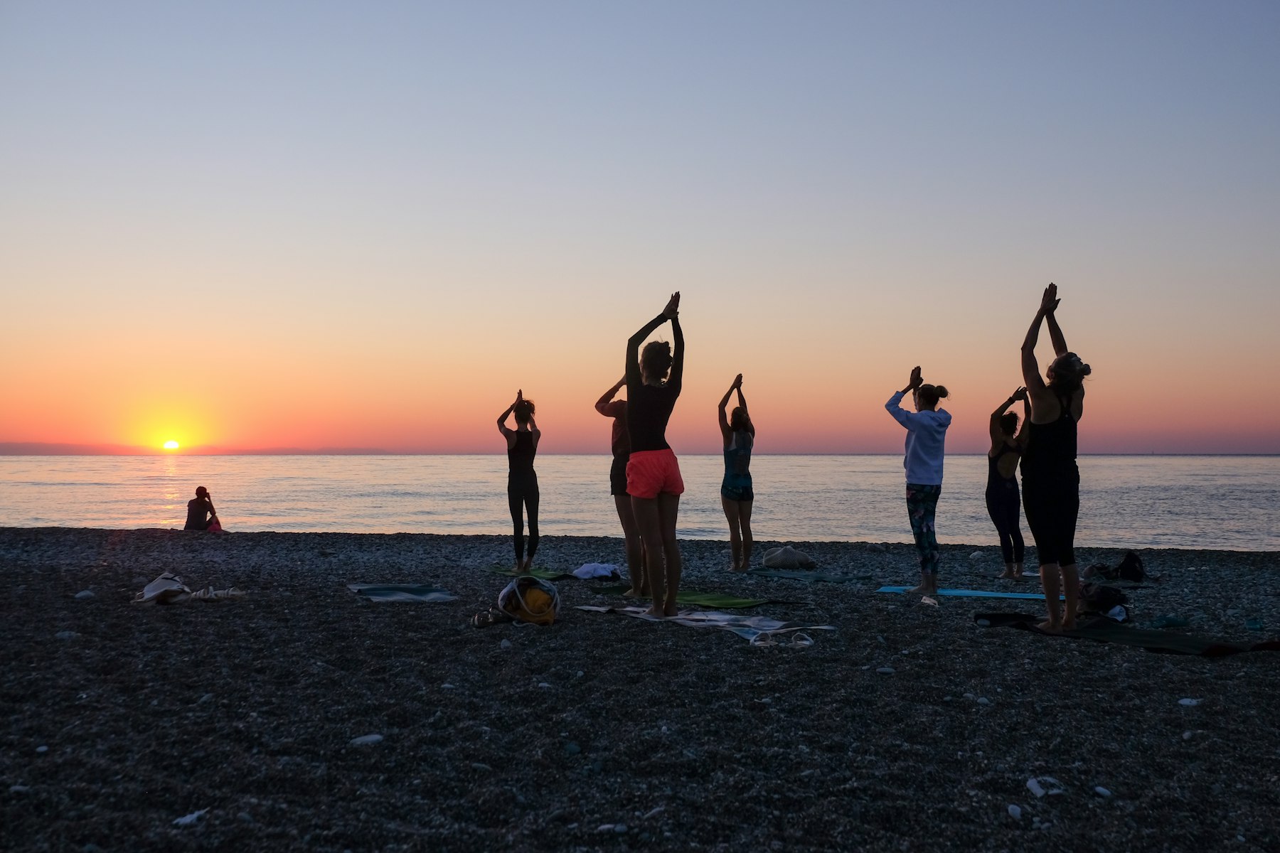 A group moving together beside the sea